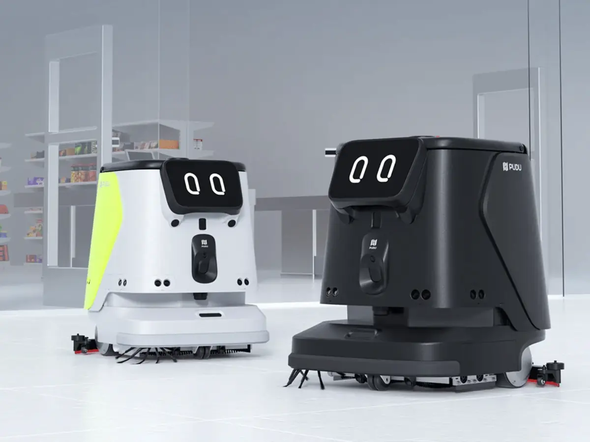 The PUDU CC1 in white and green next to the black finish
