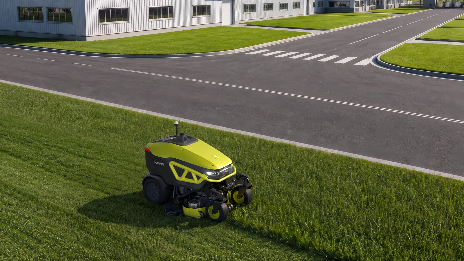 Le robot tondeuse PUDU GT3 sur la pelouse d'un site industriel